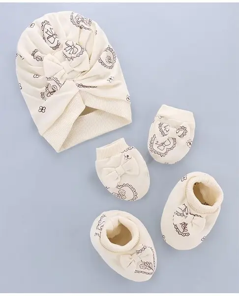 Babyoye 100% Cotton Interlock Knit With Eco Jiva Finish Cap  Mitten & Booties Set With Heart & Bow Print Beige - Diameter 14 cm